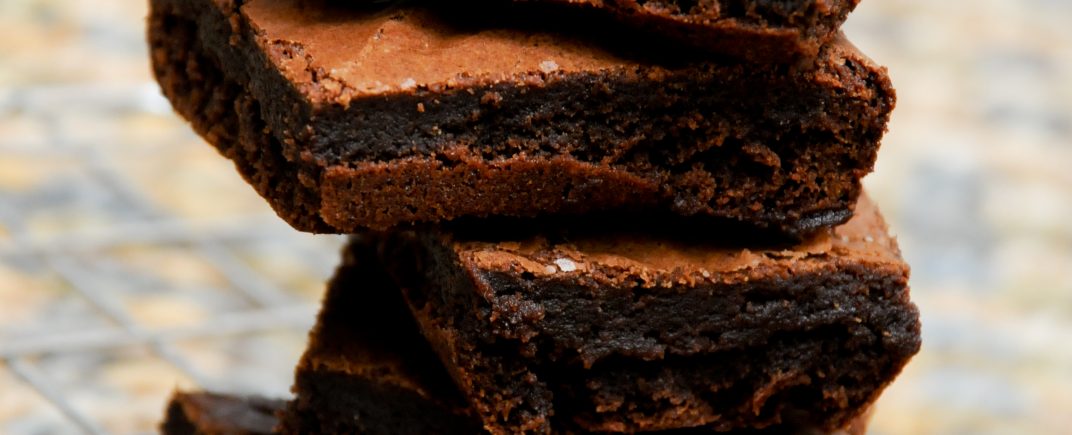 a stack of gorgeous chocolate brownies, which have been made using the West African 70% chocolate powder. The recipe can be found on the side of the pack.