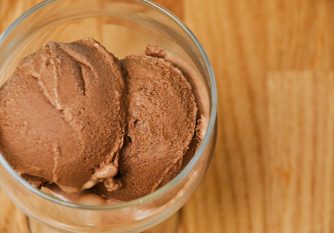 Salted Caramel Chocolate Ice cream scooped into a clear glass
